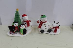 lot 125 image: Lot of (2) Snowman with Penguins Singing Dcor, Snowman with Dog Singing Dcor