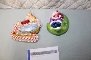 lot 165 image: Lot of (2) Christopher Radko Collection Ornaments - Santa Sleigh, Purple Santa