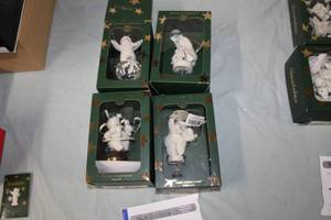 lot 149 image: Lot of (4) Department 56 Porcelain Snowbabies - One Baby In A Snowsuit, Three Shining Stars, Four Playful Penguins