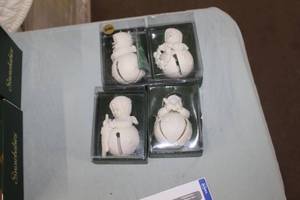 lot 146 image: Lot of (4) Department 56 Porcelain Snowbabies - Starry Pine Jinglebaby, Stars In My Stocking Jinglebaby, One Little Candle Jinglebaby, Just For You Jinglebaby