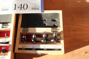 lot 140 image: Router Bit 4-Piece Set with Wood Case