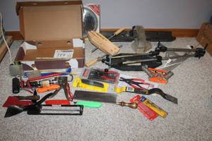 lot 219 image: Pry Bar, Hand Saw, Putty Knives, Woodworking Clamp, Saw Blades, Snap Ring Pliers, Caulk Guns, Drill Bits, Box Knives, Misc. Hand Tools