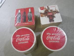 lot 195 image: Assorted Coca-Cola Coasters 4 packs...