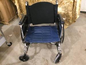 lot 35 image: MSRP $800 Invacare Tracer IV  Heavy Duty Wheelchair with Anti-Rollback Mechanism In The Seat & Handbrakes - Great Condition