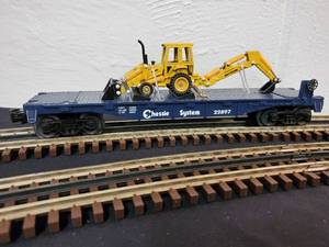 lot 154 image: Rail King Chessie Flat Car with Tractor item No. 30-7615