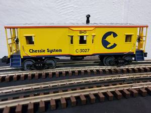 lot 156 image: Rail King 3-Rail Chessie Bay Window Caboose item No. 30-7713