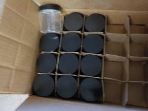 12 4 oz. glass jars with lids...