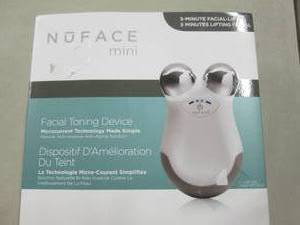 lot 11 image: NuFace Mini Facial Toning Device op...