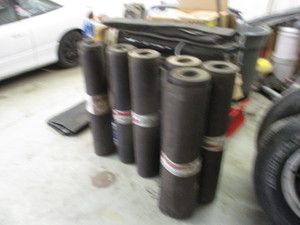 Bundles of shingles and tar paper rolls