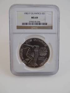 lot 4 image: 1983 P Olympics $1 M69 Graded NGC