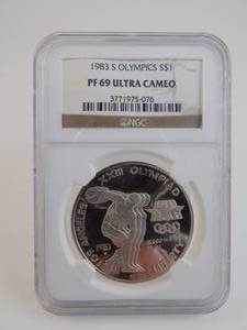 lot 12 image: 1983S Olympics $1 PF69DULTRACAMO Graded NGC