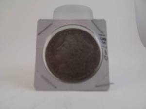 lot 57 image: 1887o Morgan Silver Dollar