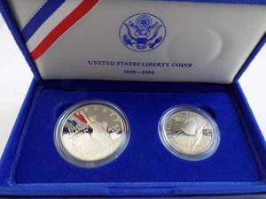 lot 88 image: 1986 US Proof Silver Dollar & Half Dollar 1886-1986 Liberty Silver Half Dollar Proof With Certificate of Authenticity In Box In Felt Box