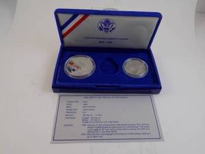 lot 92 image: 1986 US Proof Silver Dollar & Half Dollar 1886-1986 Liberty Silver Half Dollar Proof With Certificate of Authenticity In Box In Felt Box