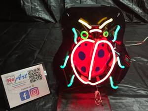 lot 8 image: Lady bug custom neon with vinyl graphics
