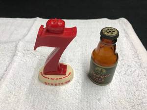 lot 110 image: Seagrams and Prager salt shakers, corks  pouring spouts, pin and keyring