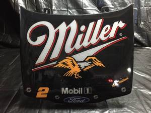 lot 87 image: Miller Mobil Ford car hood