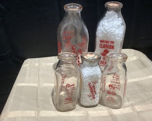 lot 2028 image: Glass Milk Bottles