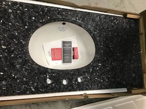 49 in. W Granite Vanity Top in Blue Pearl with White Bowl by Pegasus not used