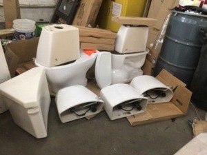 Pallet with assorted toilets customers returns include Toto brand