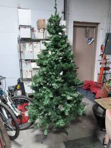 lot 101 image: 6 12 Ft. Artificial Christmas Tree With Rolling Storage Bag & Tree Stand.  100% Complete. Easy To Assemble.