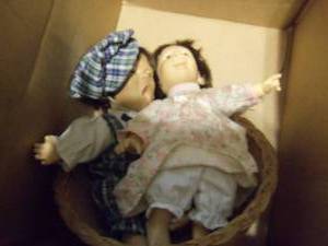 lot 49 image: Basket with 2 dolls...