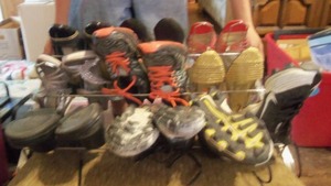 lot 101 image: Shoe rack with Shoes Cleats women s...
