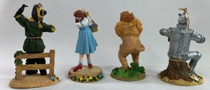 lot 81 image: Ornaments from The Wizard of Oz, Set of Four (Dorothy, Scarecrow, Lion, Tin Man) by Turner Entertainment