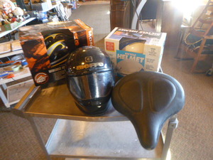 lot 28 image: 3 Helmets and Bicycle Seat