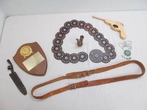 Trophy, knife sleuth, necklace, etc