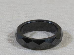 lot 84 image: Black Faceted Ring