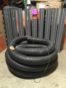 Pallet with 9 Storm Drain Series 5 in. W x 5.25 in. D x 39.4 in. L Channel Drain Kit with Portland Grey Grate and Advanced Drainage Systems4 in. x 50 ft. Corrugated Pipes Drain Pipe Perforated not used
