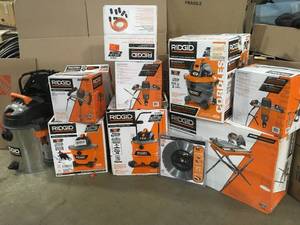Pallet with assorted Ridgid WetDry vacs open boxes see pictures