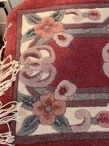 lot 1 image: Small Decorative Throw Rug