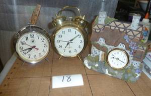 3 clocks, silver one is windup and ...