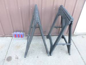 1 pair of folding plastic saw horses. Used condition. As shown.