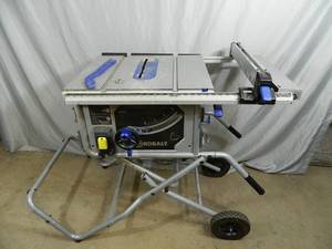 lot 12 image: Kobalt 10 inch Portable Table Saw with StandCart - Needs a Bolt