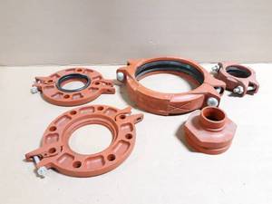 lot 77 image: (5) Victaulic  Gruvlok Pipe Clamps and Adapter