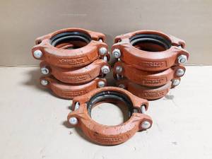 lot 306 image: (7) Victaulic 4 Pipe Coupler