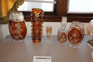 lot 59 image: Lot of (5) Clear and Brown Floral Dcor Crystal Glass Table Vases, Decanter with Topper, Shot Glass