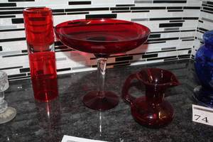 lot 73 image: Lot of (3) Red Glass Table Dcor - Vase, Pitcher, Stem Bowl