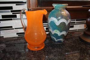 lot 75 image: Lot of (2) Orange Glass Table Pitcher, Gorgeous Designs GreenWhite Stripe Glass Table Vase