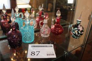 lot 87 image: Lot of (5) Crystal Glass Table Pitchers and Decanters - Red, Light Blue, Red, Red, Black with Design