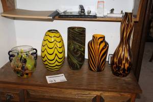 lot 93 image: Lot of (5) Glass Table Vases - Multi-color with handles, Yellow with Blue Stripe, Green Swirl, Yellow with Black Striped, Brown and Yellow Striped