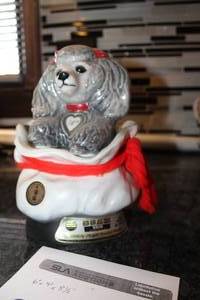 lot 89 image: Jim Beam Tiffiny Poodle in Bag Whiskey Decanter