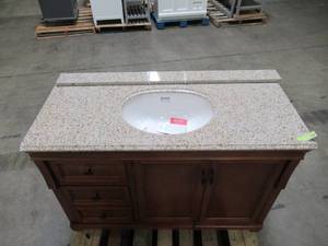 lot 307 image: Home Decorators Collection Naples 49 in. W x 22 in. D Vanity in Warm Cinnamon with Granite Vanity Top in Beige with White Sink NACA4821DL-BGE