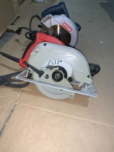 MILWAUKEE & RYOBI 7-14 in. 15 Amp CordedUSED TOOLS Circular Saw with Dust Port 2 LED Lights 24T Carbide Blade &15 Amp 7-14 in. Tilt-Lok Circular Saw with Hard Case. SEE PICS