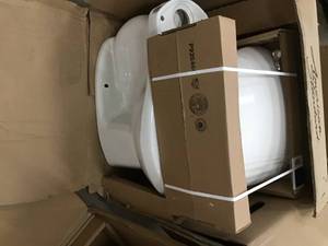 Pallet with assorted Toilets open boxes see pictures not used