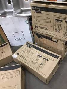 Pallet with assorted Sinks and Range hoods open boxes not used see pictures