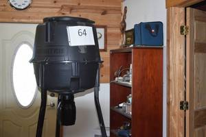 lot 64 image: Moultrie Quick Lock Directional Tripod 30-Gallon Deer Feeder